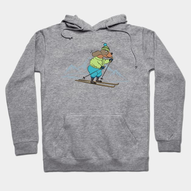 Cute Dog Skiing in the Winter Mountains Hoodie by Pixels Pantry